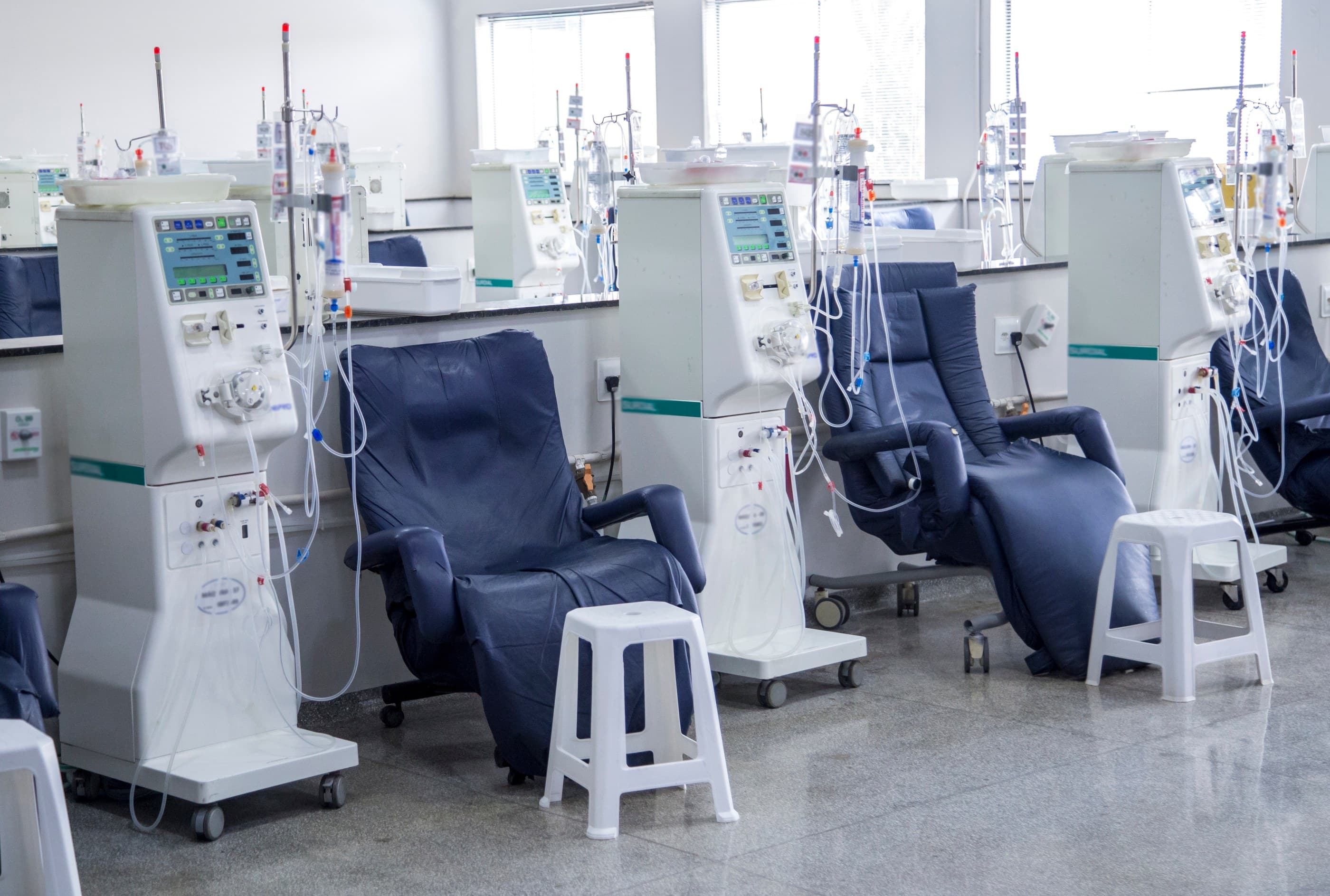 A row of dialysis treatment chairs in a bright, modern Elleon Management centre
